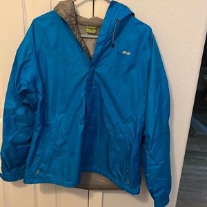 Women’s size Large Koppen bright blue windbreaker with hood